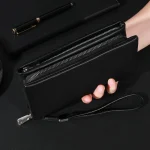 pochette en cuir noir CUIORREY